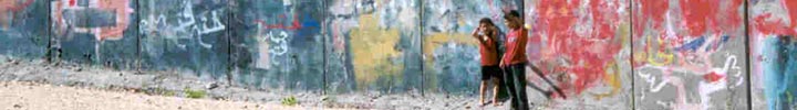 Palestinian wall, boys waving in foreground